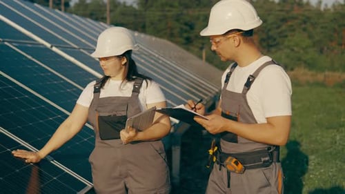 Professional Engineers Workers Check the Operation of a Solar Power Plant