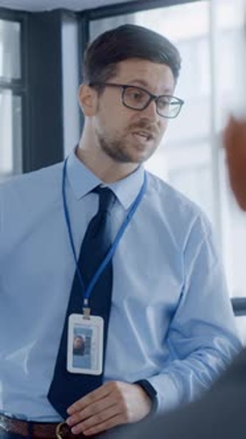 Professional Man Explains Business Strategy in Office Setting