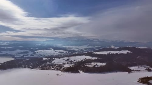 Aerial view of winter landscapes with snow-covered mountains and lakes