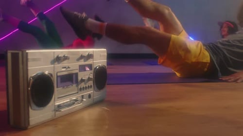 Retro Fitness: Group Workout with Boombox and Neon Lights
