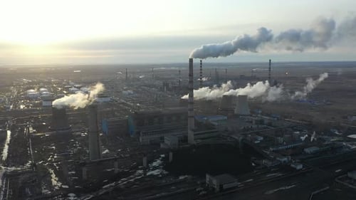 Aerial View of Thermal Power Plant Drone Flies Over Chimney Smoke Pipes and Cooling Towers of