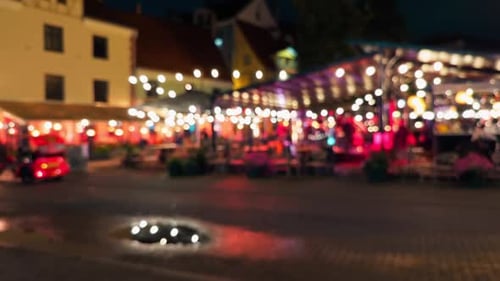 A Vibrant Night Market Scene Filled with Twinkling Lights and Inviting Outdoor Seating Areas for All