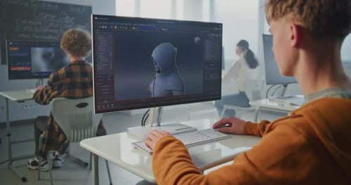 Focused Student in University Game Development Course Designs 3D Character for Video Game