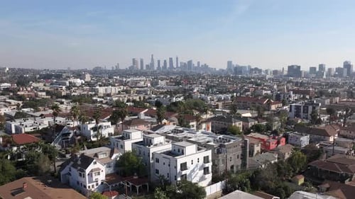 Rising Aerial Shot Of Downtown Los Angeles Skyline From East Hollywood. Famous Travel Destination.