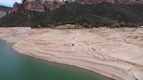 Ruined church by the reservoir. Aerial shot