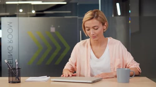 Happy Cheerful Satisfied Young Woman Finished Her Work Closing Laptop in Office