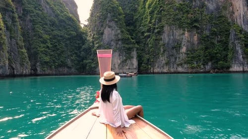 Discover Paradise in Krabi Thailand While Enjoying a Refreshing Drink on a Boat