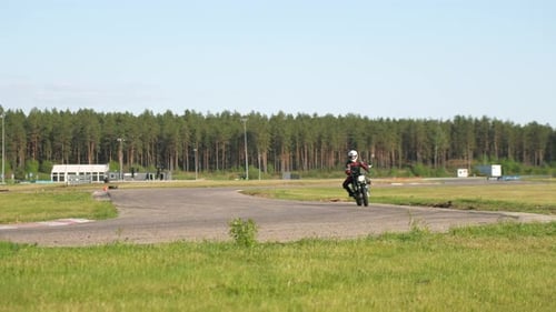Wider radius cornering on a roadster racetrack motorcycle
