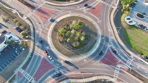 View From Above of Roundabout Crossroads on American City Street with Moving Traffic Cars Urban