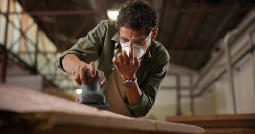 Wood, carpenter and sanding with machine of person in workshop for furniture