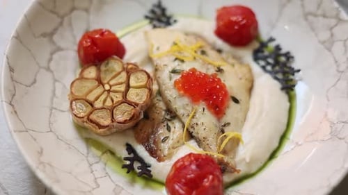 chef prepares a delicious fish dish. Close-up