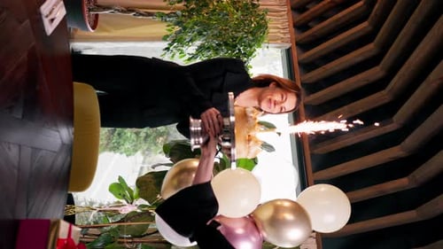 Woman Celebrates Birthday with Cake and Sparklers