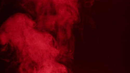Abstract Red Smoke Flowing on Dark Background