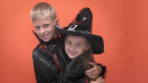 Boy and Girl Hugging in Halloween Costumes