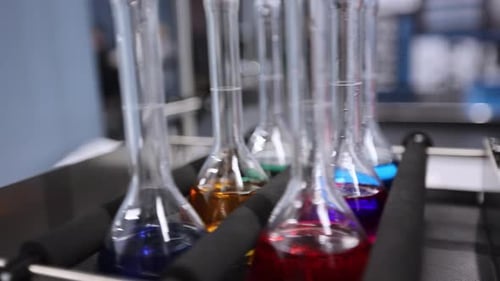 Laboratory Shaker with Colorful Liquids in Beakers