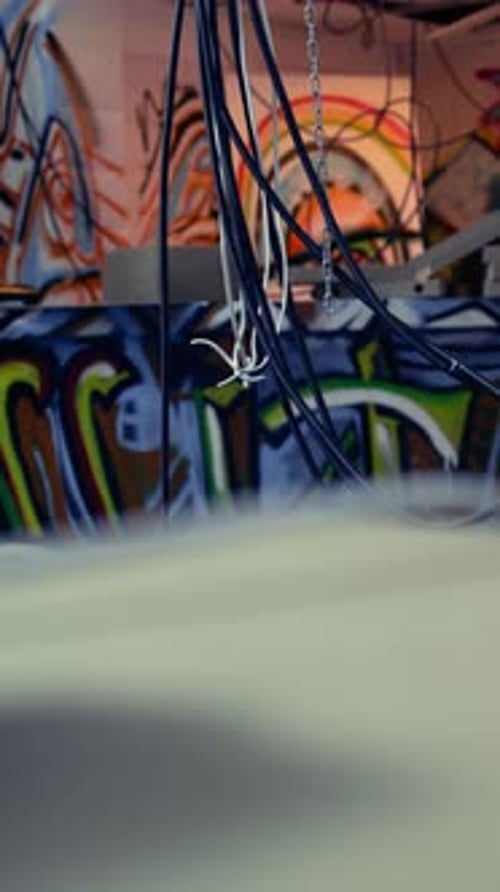 Abstract Graffiti Wall with Hanging Wires