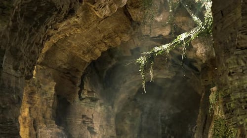 Moving Through Sunlit Rocky Cave with Dust Particles