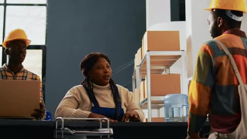 Warehouse Colleagues Checking Supplies Stock in Depot
