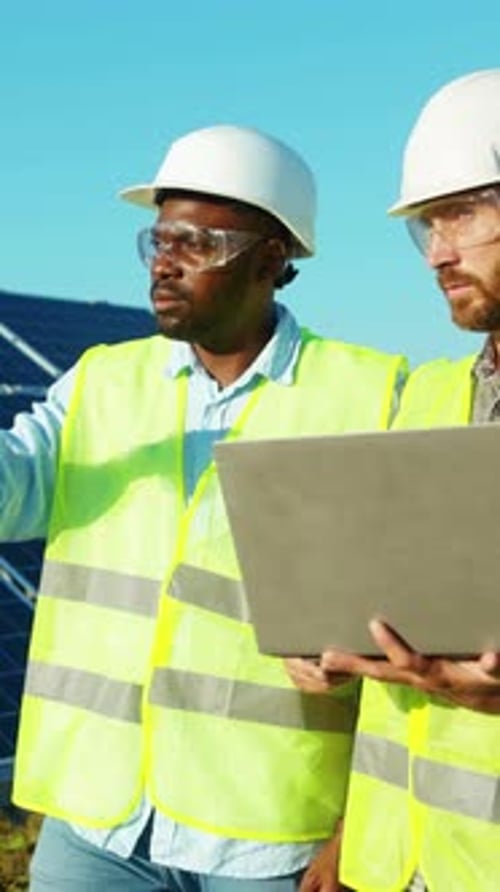 Engineers are Actively Collaborating Together on the Installation of Solar Panel Systems
