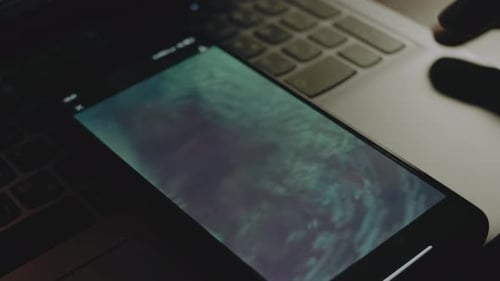 Circle Water Waves Surface Background on Mobile Phone Screen Male Hand Flapping with Fingers