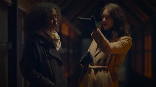 Two Women Arguing on a City Street at Night