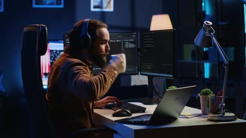 Programmer Does Multitasking Drinks Coffee Listens Music