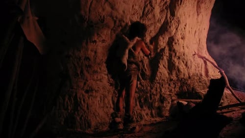 Cave Dweller Creating Art on Cave Wall