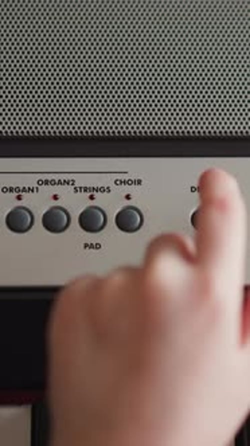 Child Adjusts Tempo Turns on Metronome and Mode on Piano