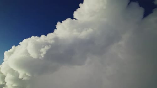 Majestic Cloudscape Evolving Under Sunlight