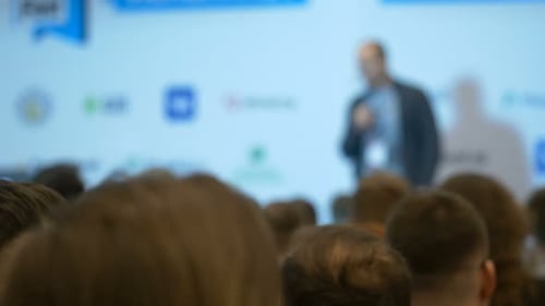 Blurred Conference with Speaker and Audience
