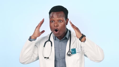 Man, angry doctor and screaming for stress in studio isolated on a blue background