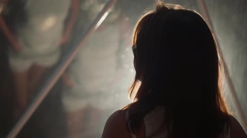 Woman Stares at Her Reflection in Prism