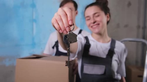 Own Home Mortgage Relocation Concept Happy Couple Holding Key From New First House Family