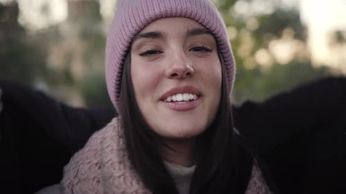 Portrait Beautiful Smiling Young Caucasian Woman in Winter Hat Looking Camera Gesturing Feeling Cold