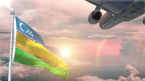Flag Waving with Airplane Flying in Sunset Sky Background