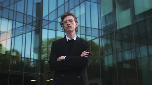 Stylish Young Adult Posing Confidently in Urban Setting