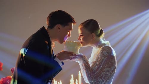 Romantic Couple Holding Cake with Candles