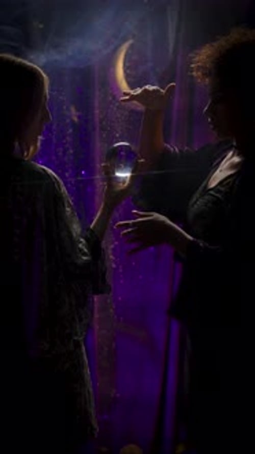 Women with Crystal Ball in Mystical Setting