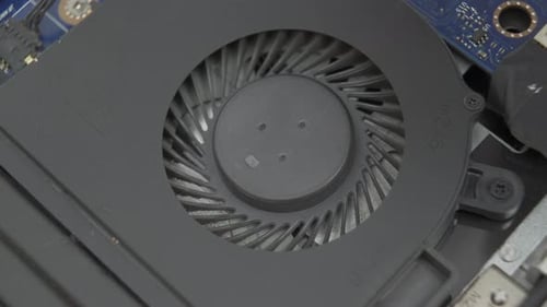 Macro Shot Cleaning Laptop Cooling System During Maintenance