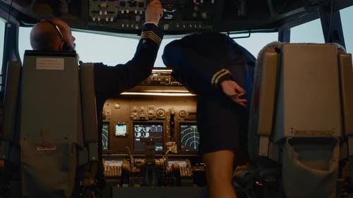 Captain and Woman Copilot in Cockpit Preparing to Fly Airplane