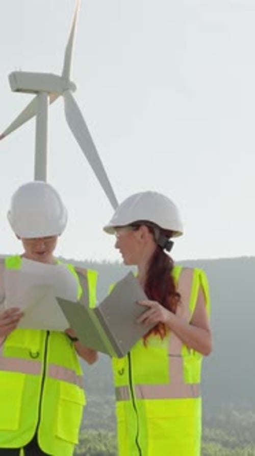 A Group of Engineers is Actively Collaborating on the Detailed Analysis of a Wind Farm Project