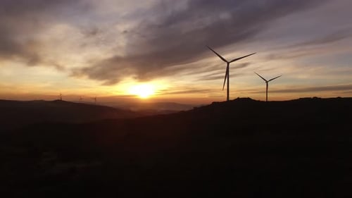 Wind Turbines Generating Green Energy at Sunset