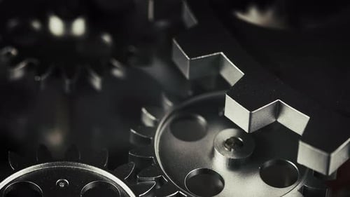 Silver Gears Rotating in Macro View