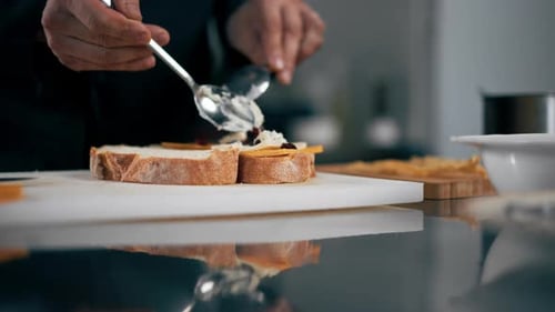 Closeup in Professional Kitchen Chef Folding Cheese Bruschettas Restaurant Serving
