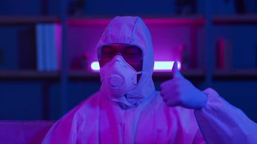 Person in Hazmat Suit Giving Thumbs Up