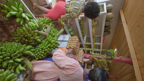 Vertical View Of African Ladies Talking In The Stall Market In Kampala, Uganda, Africa. Close-up Sho