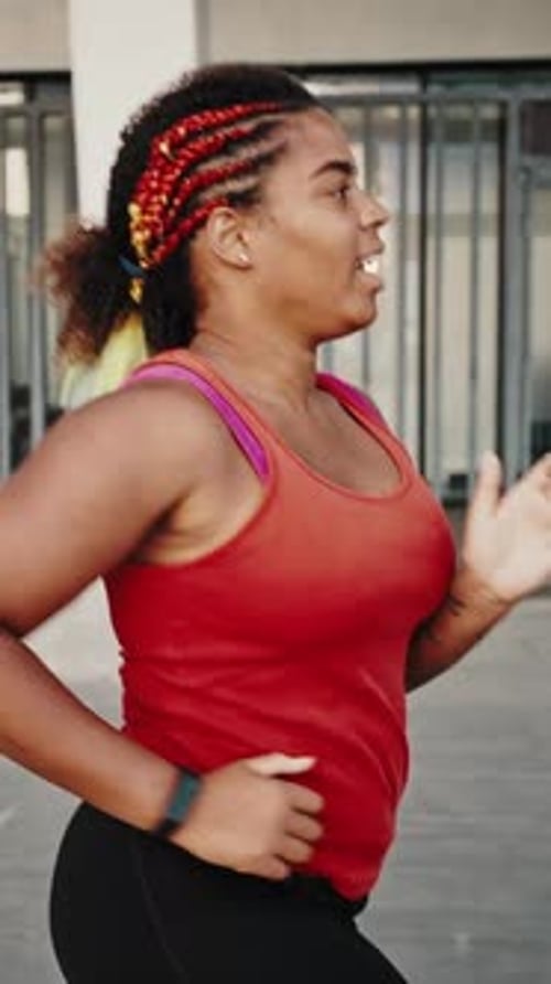 Woman Running For Fitness in Urban Environment
