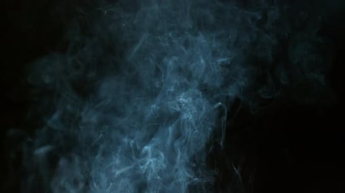 Mysterious Blue Smoke Plumes Against Black Background