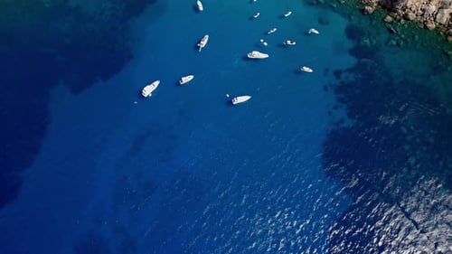 Revealing shot of yacht´s anchor on bay surround by high mountain on Mallorca´s west coast