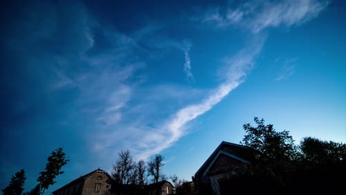 Amazing evening to night timelapse showing clouds, milkyway and meteors over houses. Stars start app